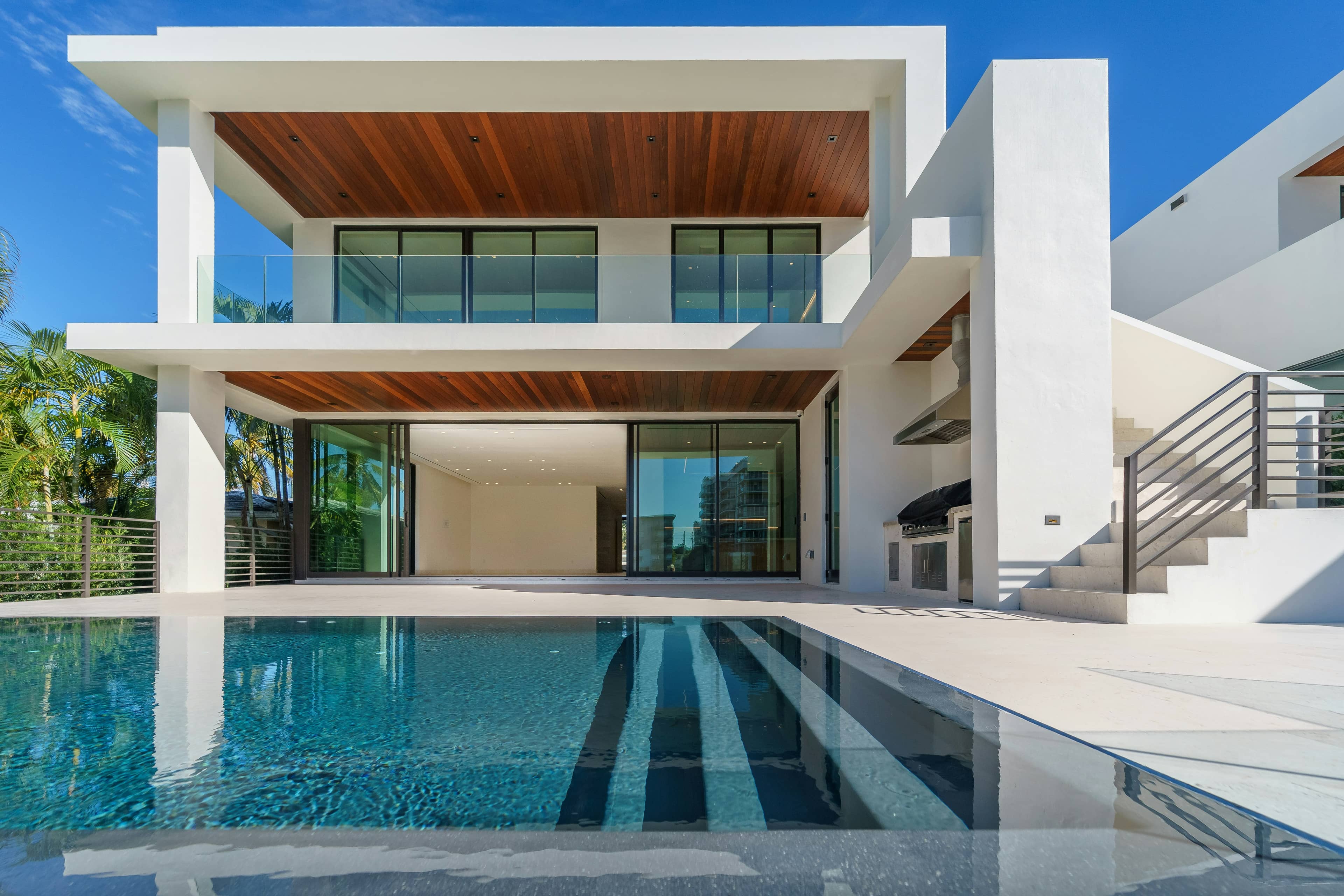 Contemporary two-storey house with a clean white and grey elevation